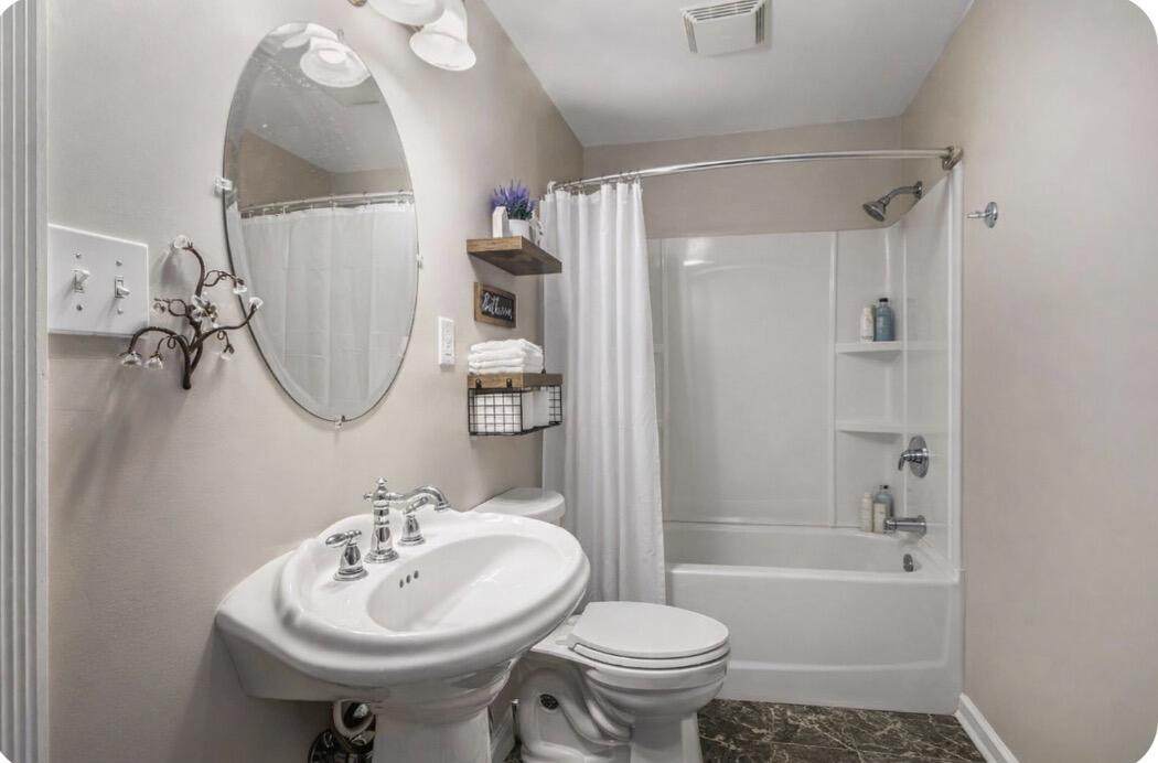 10588 Erie Drive Crown Point, IN 46307 - Photo 30 of 45 a bathroom with a sink toilet and shower