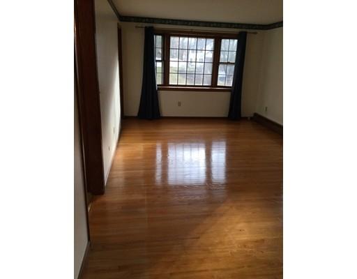 8 Hemingway Road Wilbraham, MA 01095 - Photo 13 of 28 a view of an empty room with wooden floor and a window