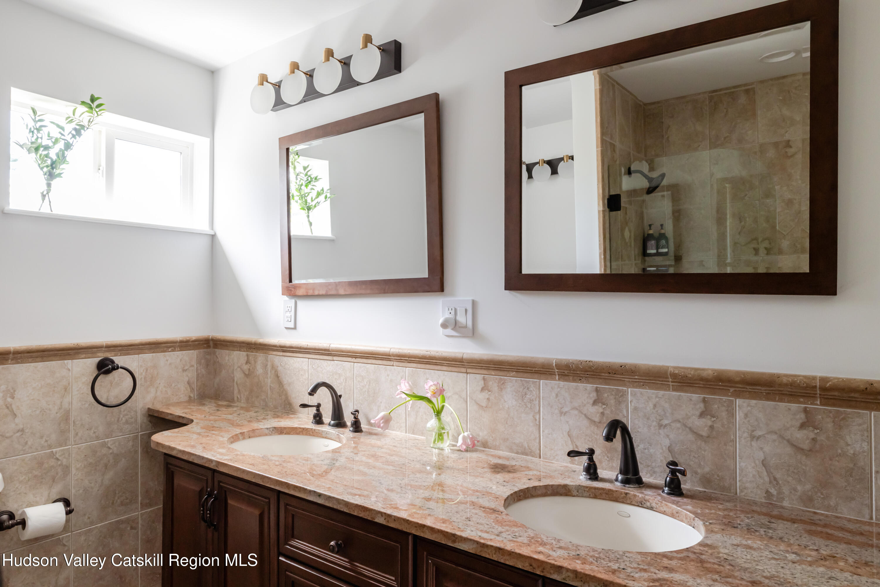 2295 State Rte 32 South New Paltz, NY 12561 - Photo 32 of 46 a bathroom with a granite countertop sink and a mirror