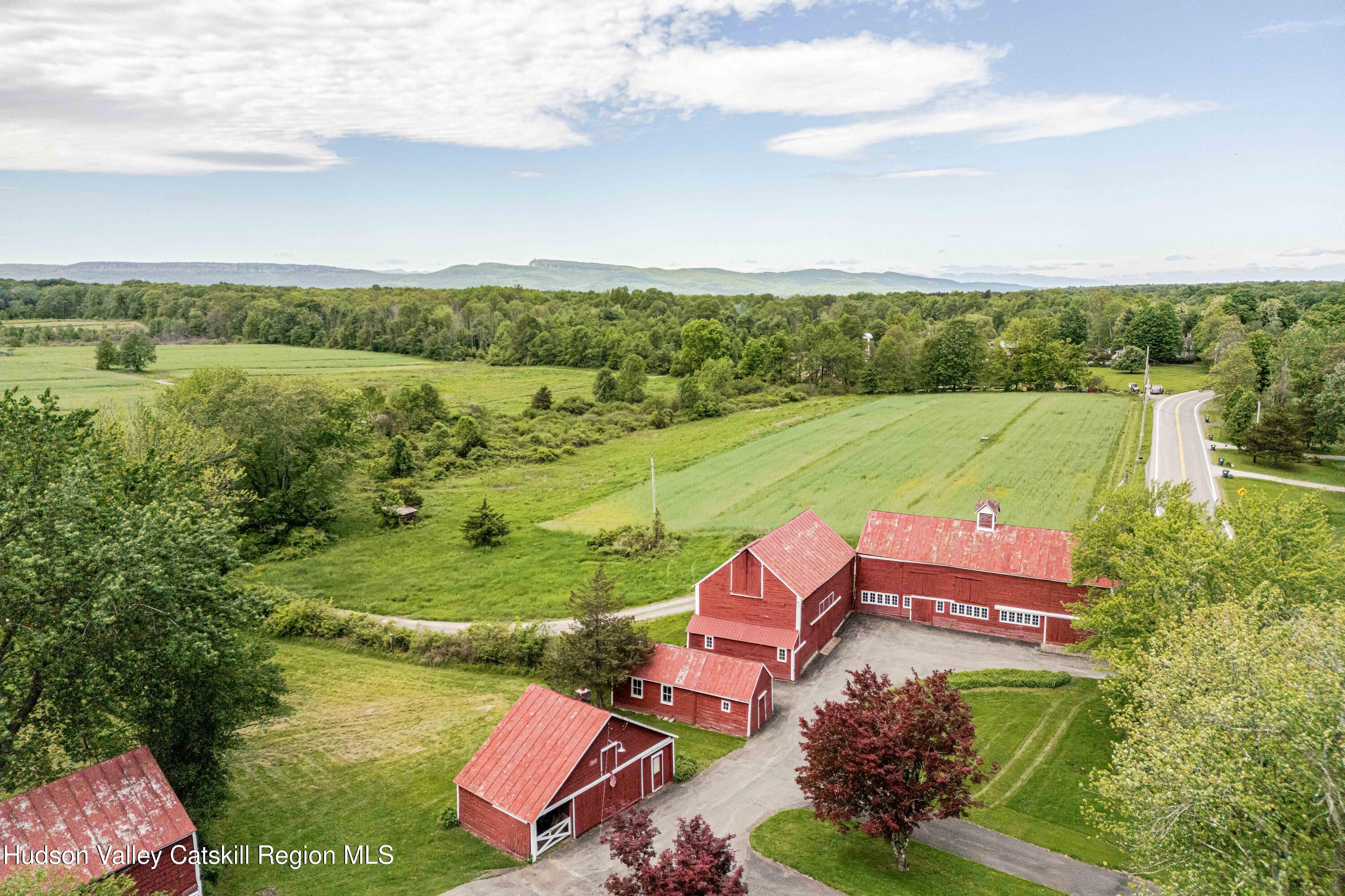 2295 State Rte 32 South New Paltz, NY 12561 - Photo 4 of 46 an aerial view of a house with a garden and lake view