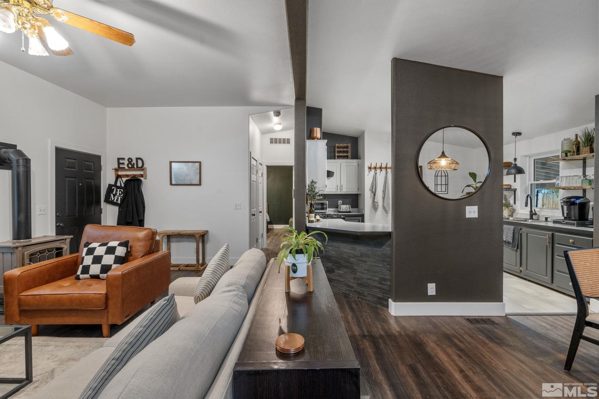 1327 Lynx Street Reno, NV 89506 - Photo 13 of 38 a living room with furniture and a clock