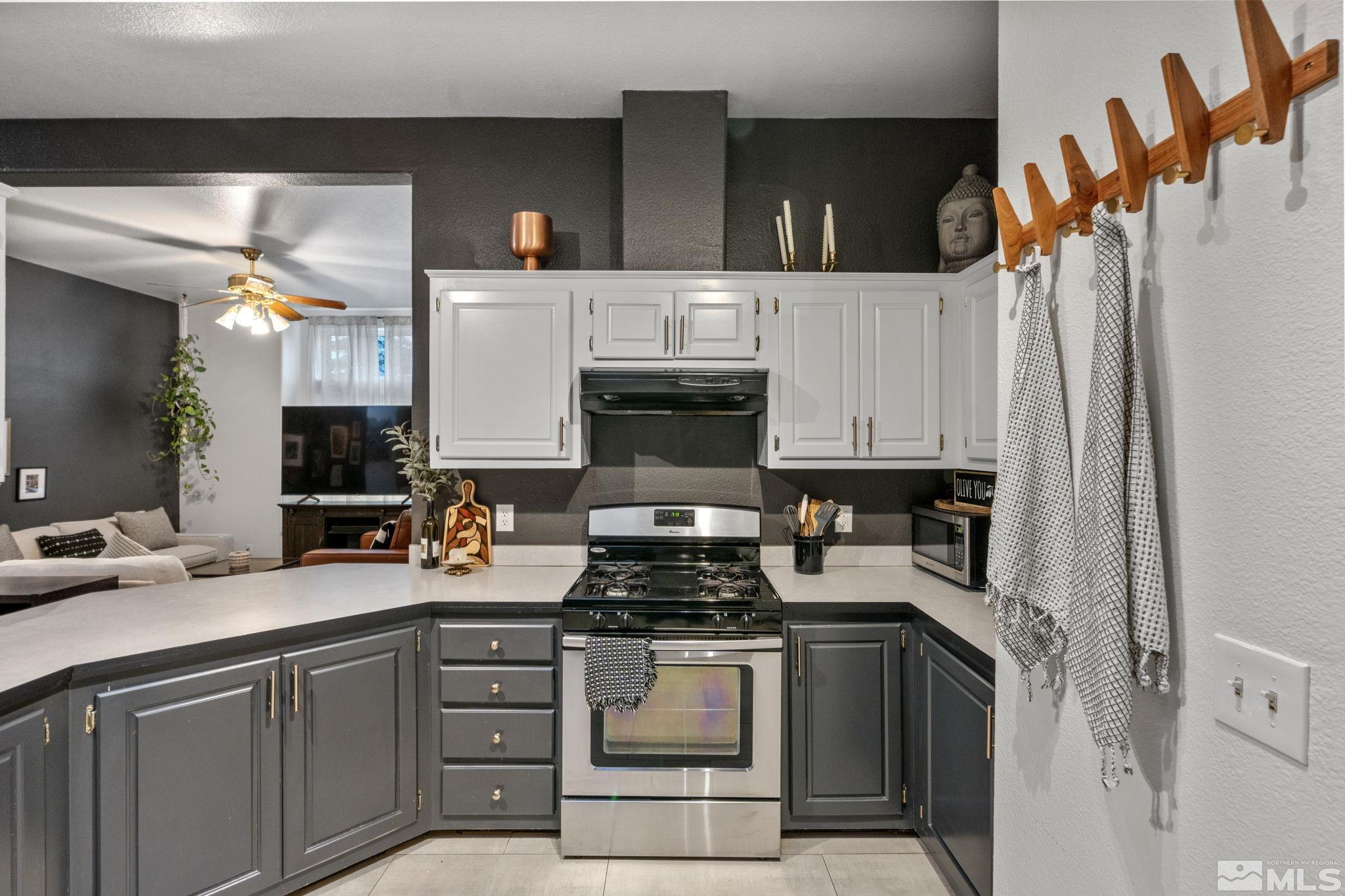 1327 Lynx Street Reno, NV 89506 - Photo 15 of 38 a kitchen with a stove and a refrigerator