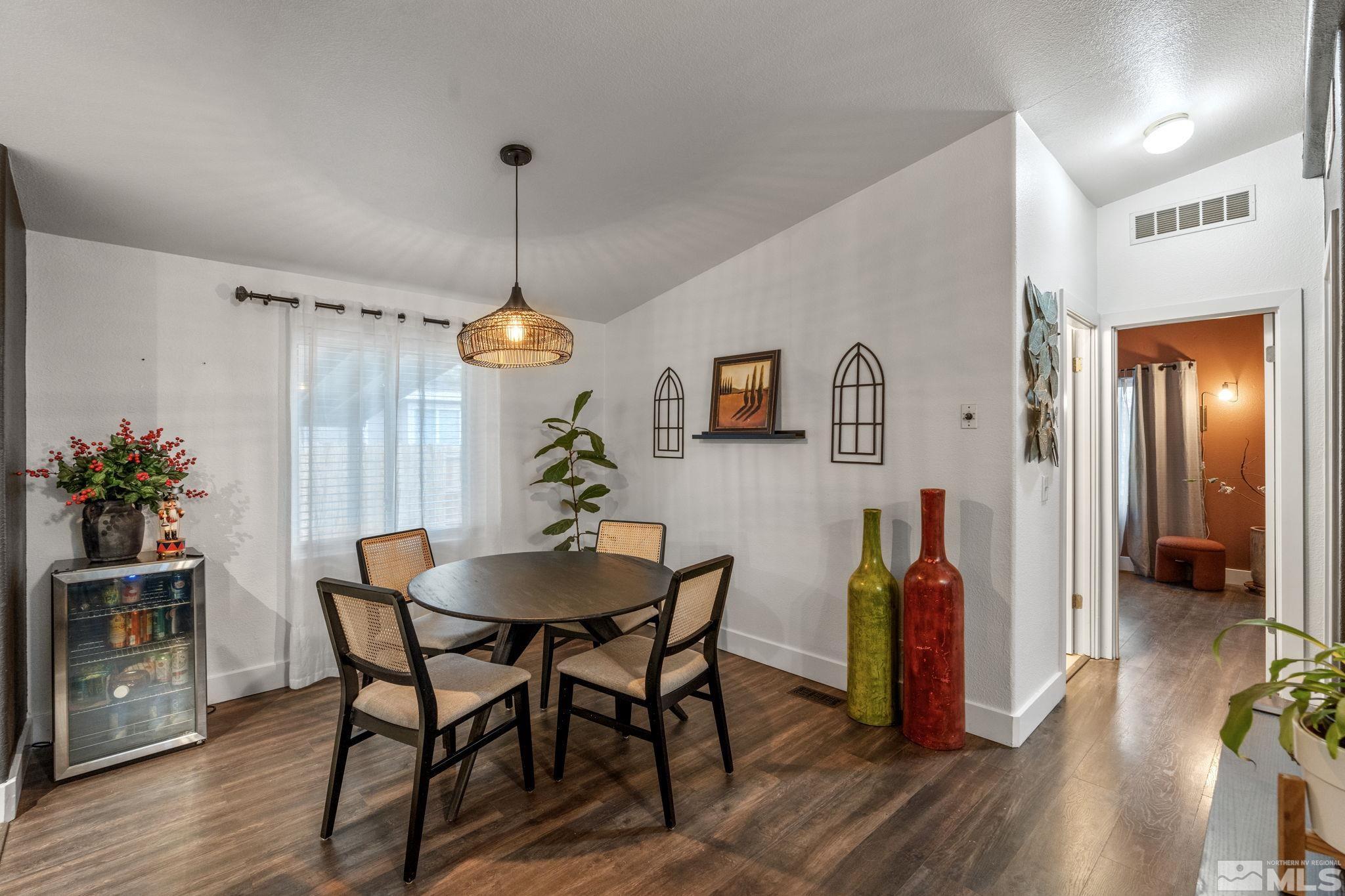 1327 Lynx Street Reno, NV 89506 - Photo 24 of 38 a view of a dining room with furniture wooden floor and chandelier