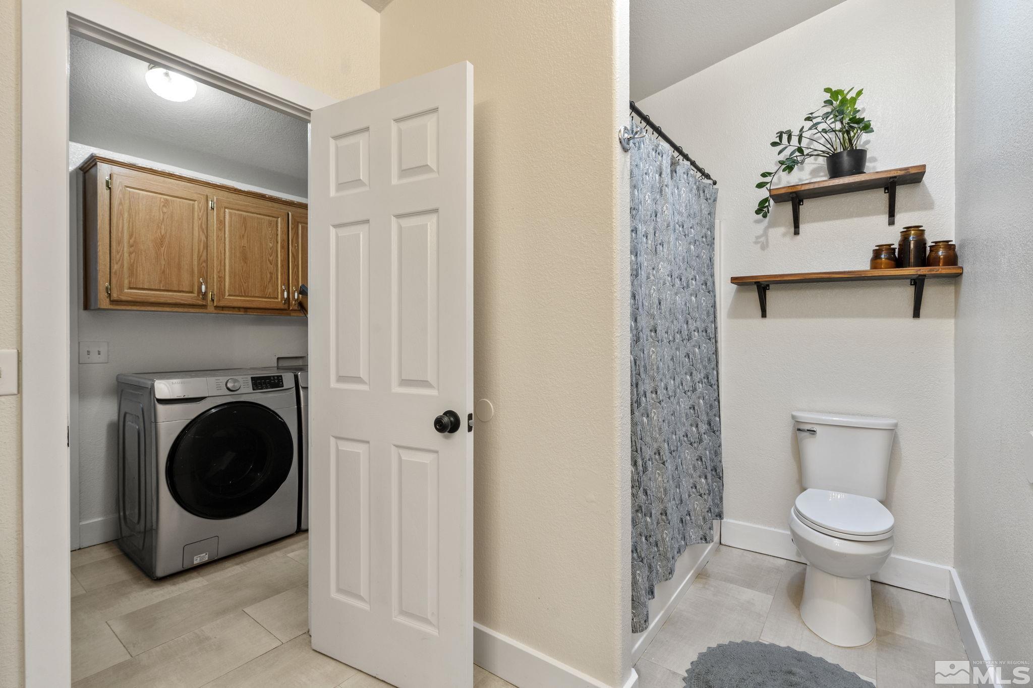 1327 Lynx Street Reno, NV 89506 - Photo 29 of 38 a bathroom with a toilet and a sink