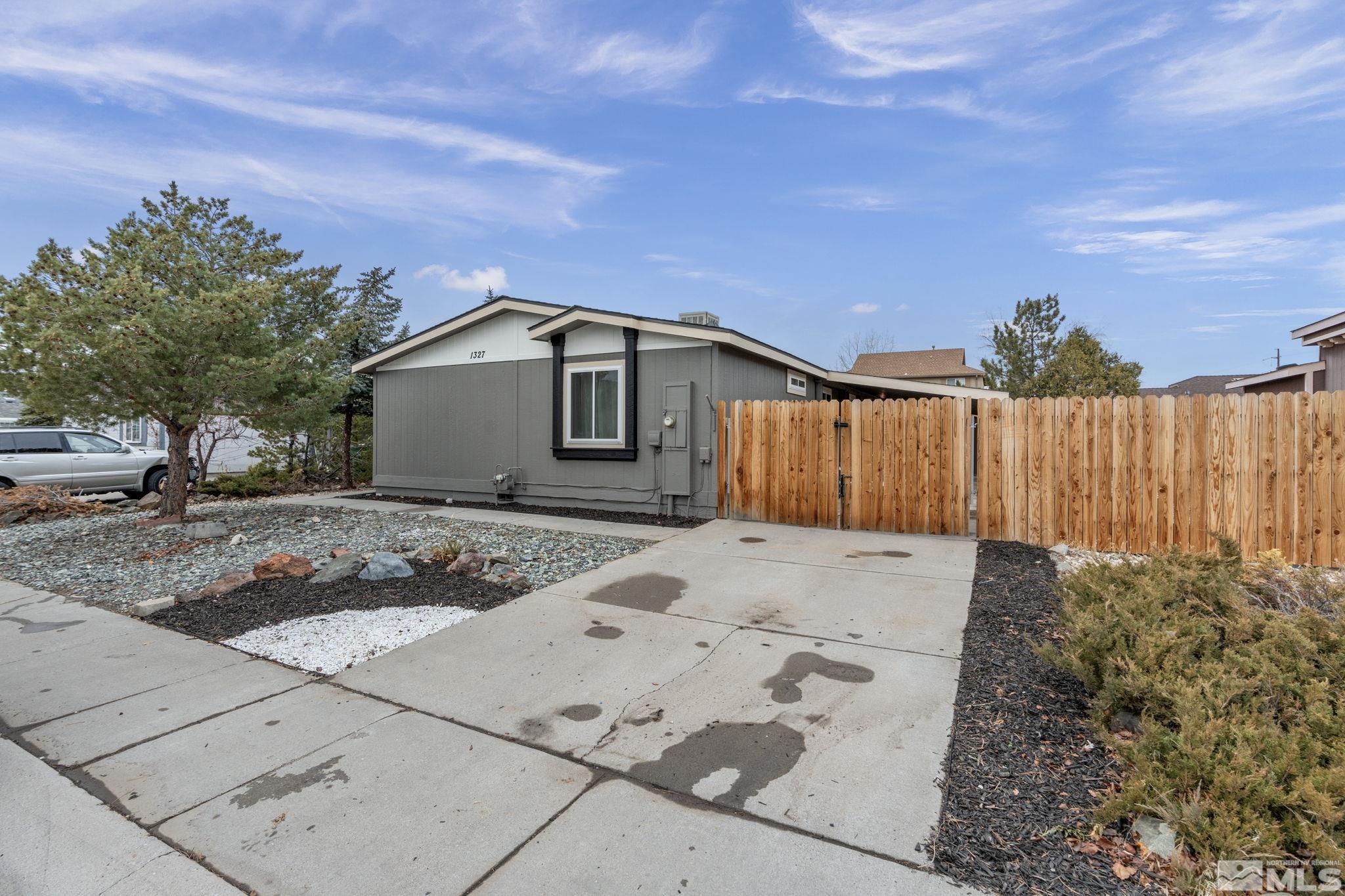 1327 Lynx Street Reno, NV 89506 - Photo 3 of 38 a front view of a house with a yard