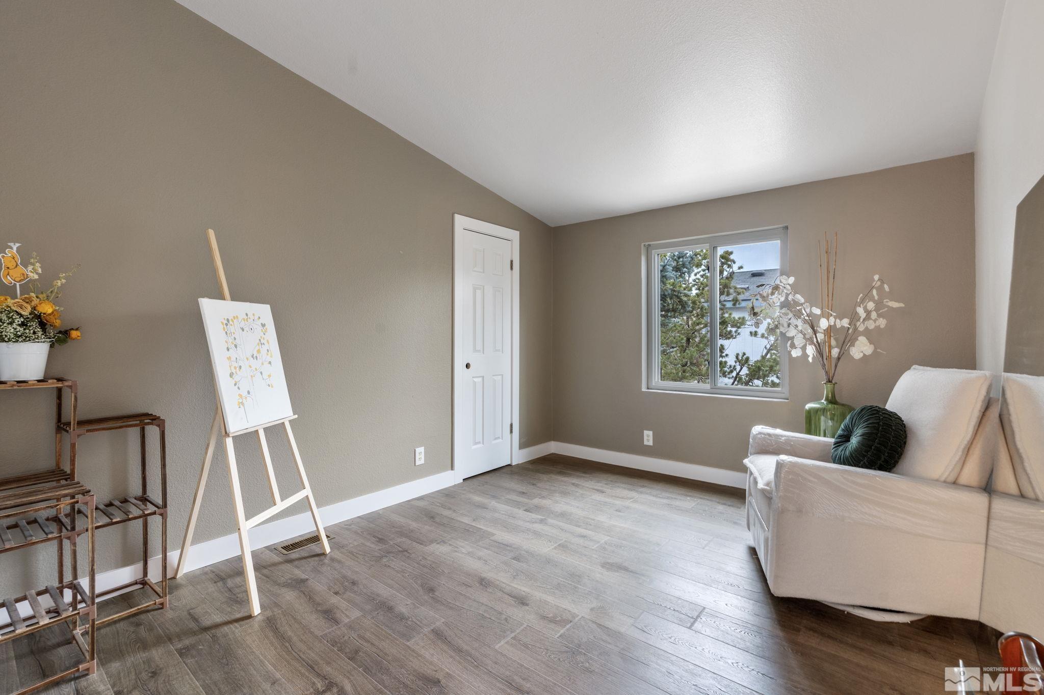 1327 Lynx Street Reno, NV 89506 - Photo 32 of 38 a living room with furniture and a window