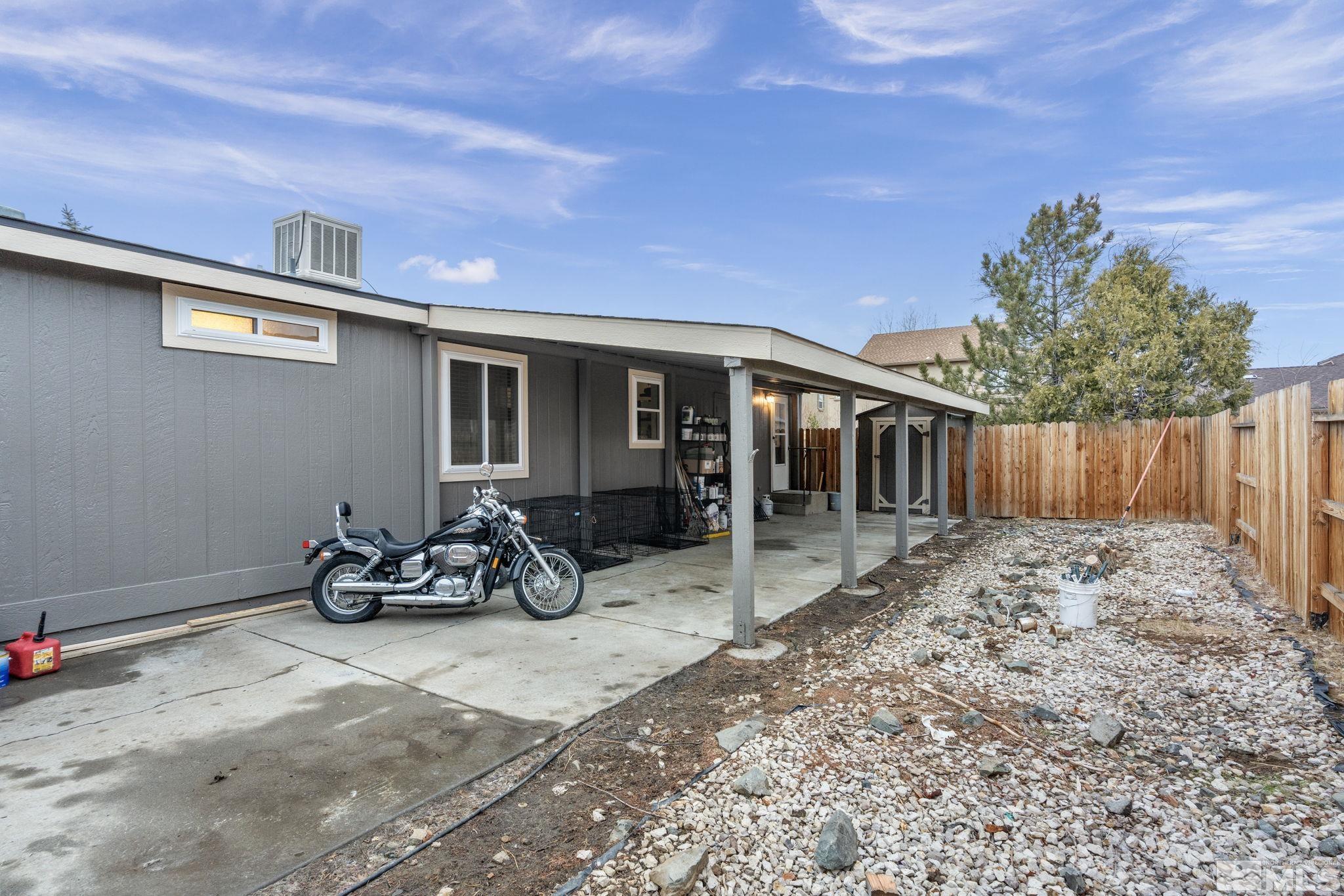 1327 Lynx Street Reno, NV 89506 - Photo 35 of 38 a view of a dinning table and chairs in patio
