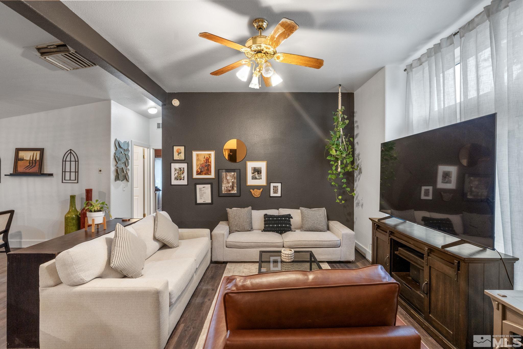 1327 Lynx Street Reno, NV 89506 - Photo 10 of 38 a living room with furniture and a flat screen tv