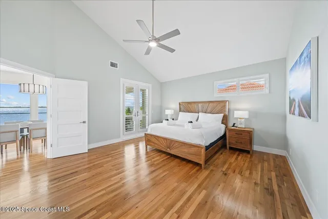 a living room with furniture a table tennis table and a flat screen tv