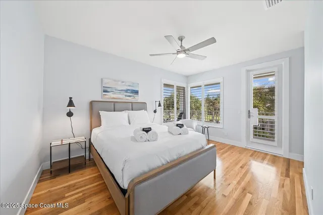 a spacious bedroom with a bed and a window