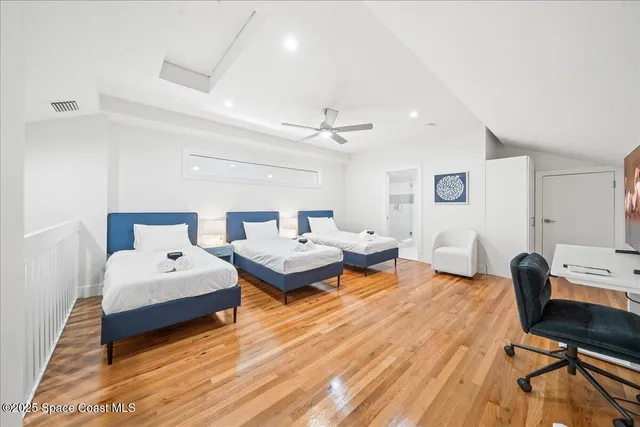 a bathroom with a double vanity sink a mirror a bathtub and