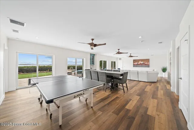 a view of a patio with a table and chairs