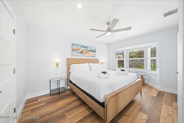 a view of a yard and palm trees