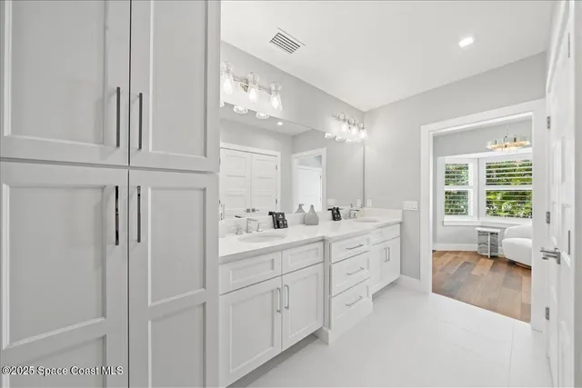 an aerial view of a house with a lake view