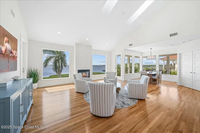 a view of a dining room with furniture wooden floor and chandelier