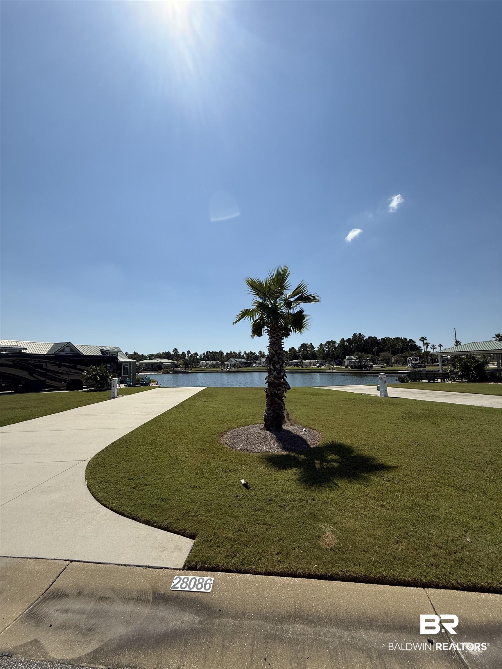 28086 Migratory Way Elberta, AL 36530 - Photo 4 of 46 View of community featuring a yard and a water view
