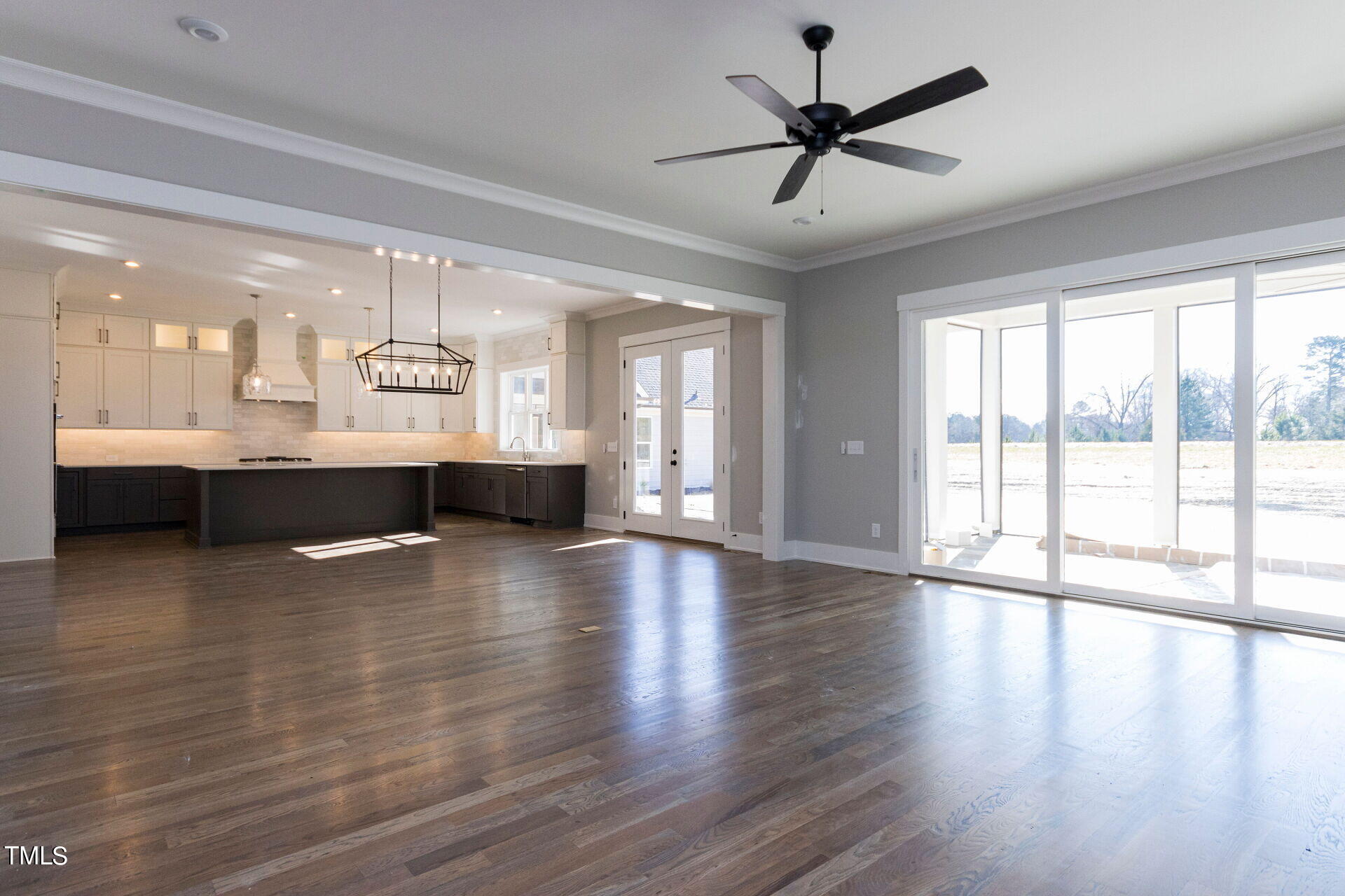 155 Gaines Trail Pittsboro, NC 27312 - Photo 32 of 86 a view of an empty room with a window and wooden floor
