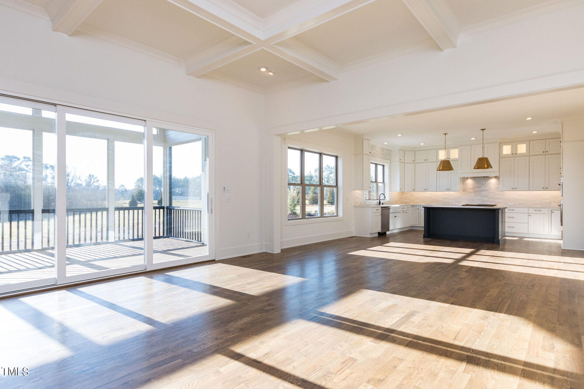 155 Gaines Trail Pittsboro, NC 27312 - Photo 39 of 86 a view of an empty room with wooden floor and a floor to ceiling window