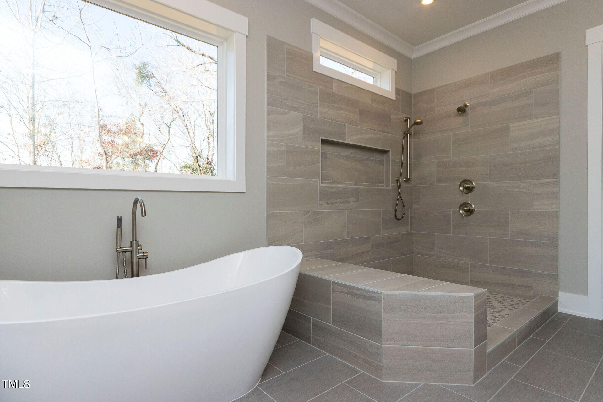 155 Gaines Trail Pittsboro, NC 27312 - Photo 48 of 86 a bathroom with a bathtub and window