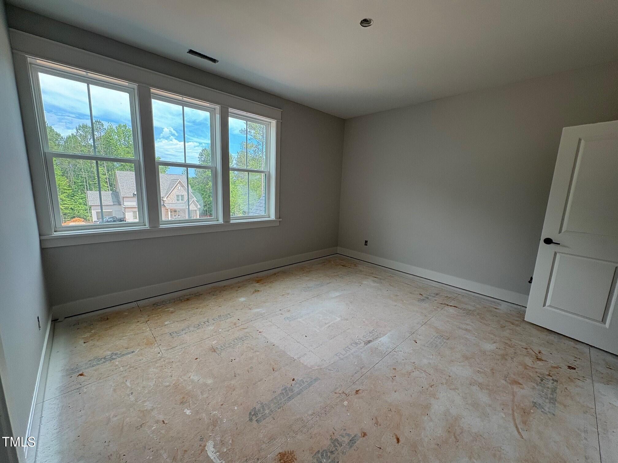 155 Gaines Trail Pittsboro, NC 27312 - Photo 77 of 86 an empty room with a fireplace