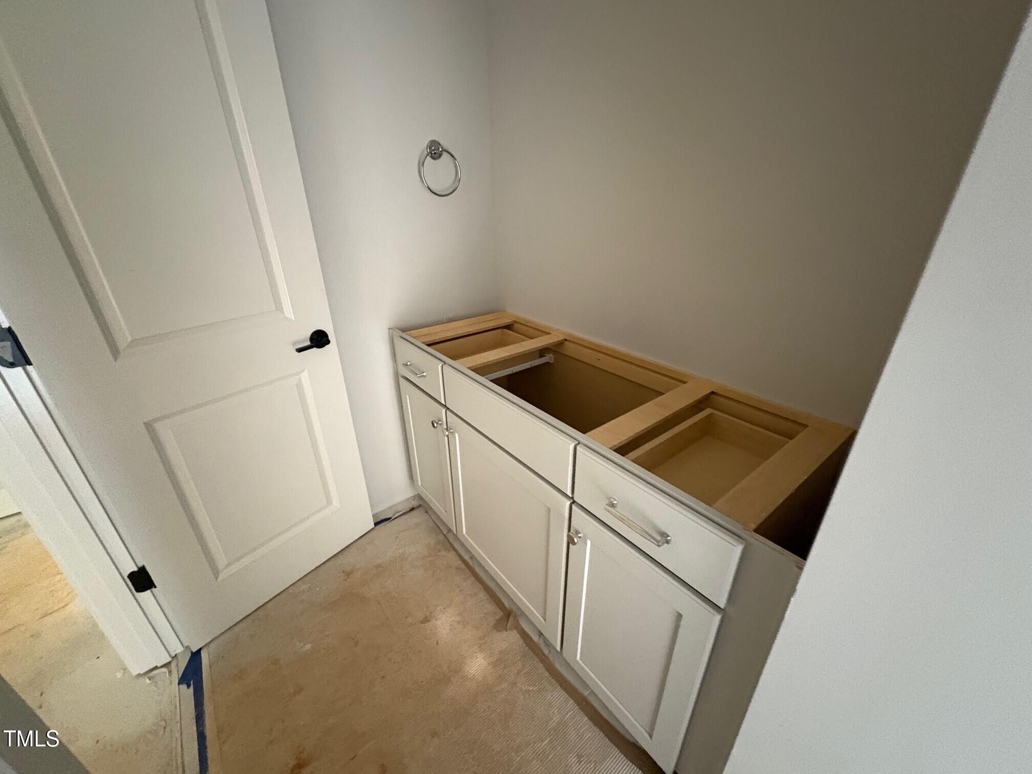 155 Gaines Trail Pittsboro, NC 27312 - Photo 79 of 86 a kitchen with white cabinets and white appliances