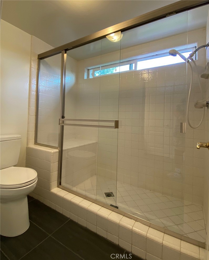 43 Fortuna Irvine, CA 92620 - Photo 16 of 26 a bathroom with a shower and a toilet