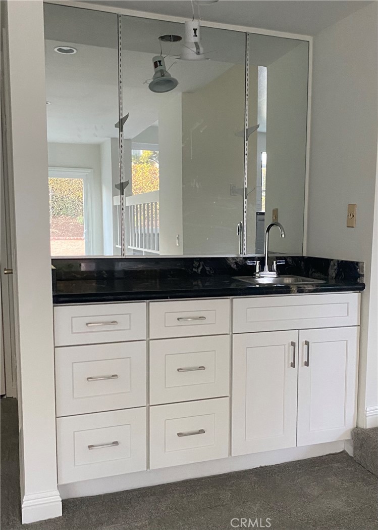 43 Fortuna Irvine, CA 92620 - Photo 18 of 26 a bathroom with a sink and a mirror