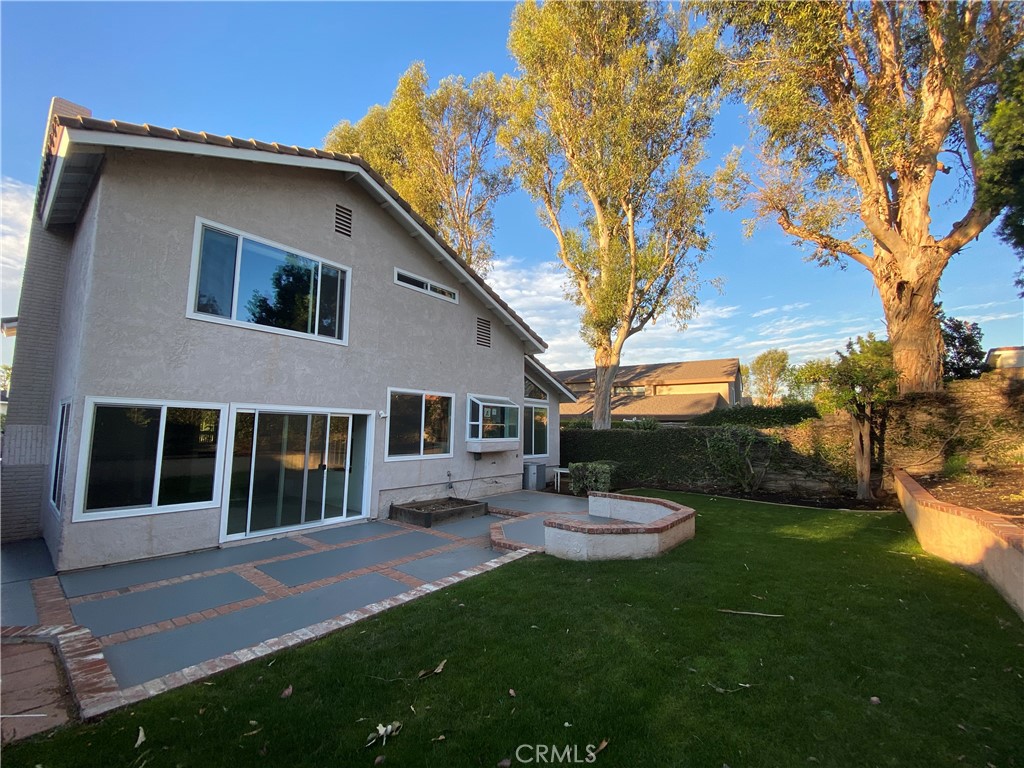 43 Fortuna Irvine, CA 92620 - Photo 24 of 26 a view of a house with backyard porch and sitting area