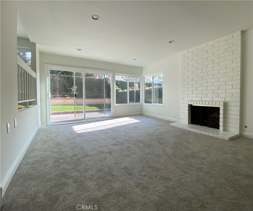 43 Fortuna Irvine, CA 92620 - Photo 4 of 26 an empty room with floor to ceiling window and an outdoor view