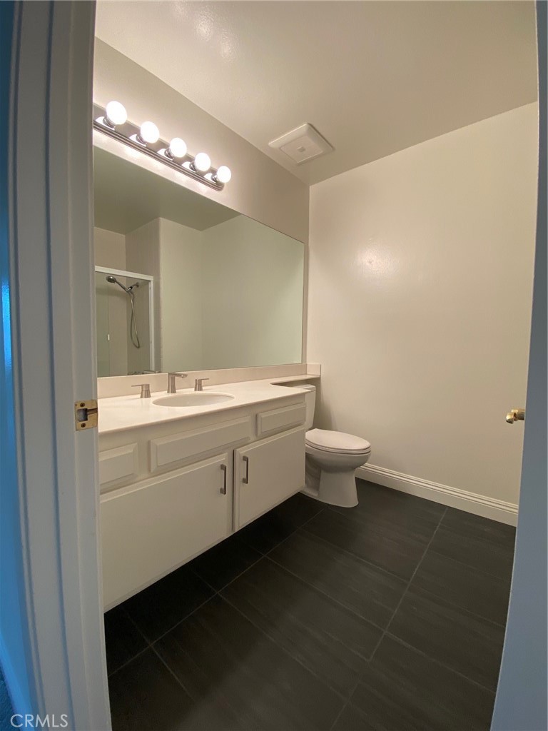 43 Fortuna Irvine, CA 92620 - Photo 10 of 26 a bathroom with a double vanity sink mirror and toilet
