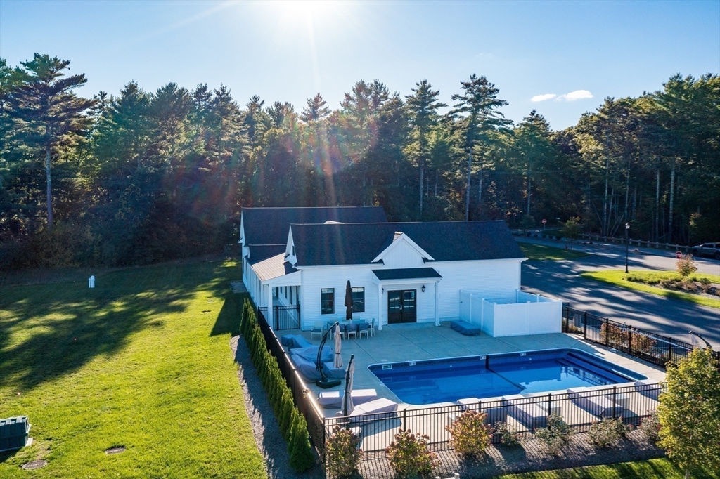 4 Sarah Beth Lane, Unit 1 Wareham, MA 02571 - Photo 12 of 42 a view of swimming pool with sitting area and garden
