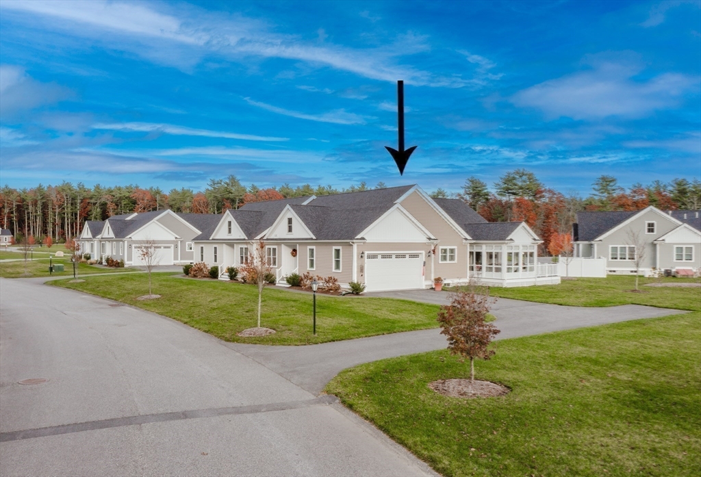 4 Sarah Beth Lane, Unit 1 Wareham, MA 02571 - Photo 2 of 42 a front view of a house with a yard