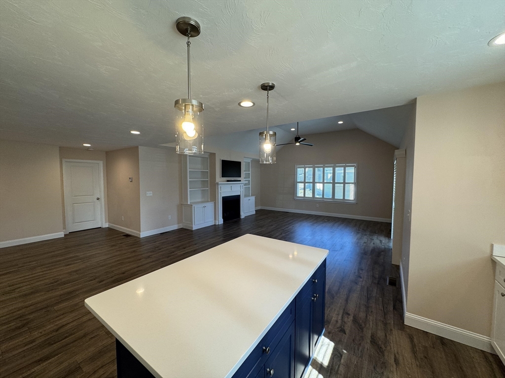 4 Sarah Beth Lane, Unit 1 Wareham, MA 02571 - Photo 22 of 42 a view of a kitchen with a table and chairs