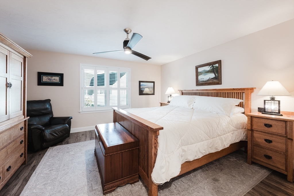 4 Sarah Beth Lane, Unit 1 Wareham, MA 02571 - Photo 29 of 42 a bedroom with a bed and wooden floor