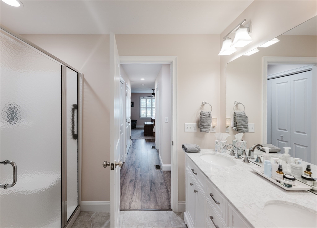 4 Sarah Beth Lane, Unit 1 Wareham, MA 02571 - Photo 31 of 42 a spacious bathroom with a double vanity sink a mirror and shower