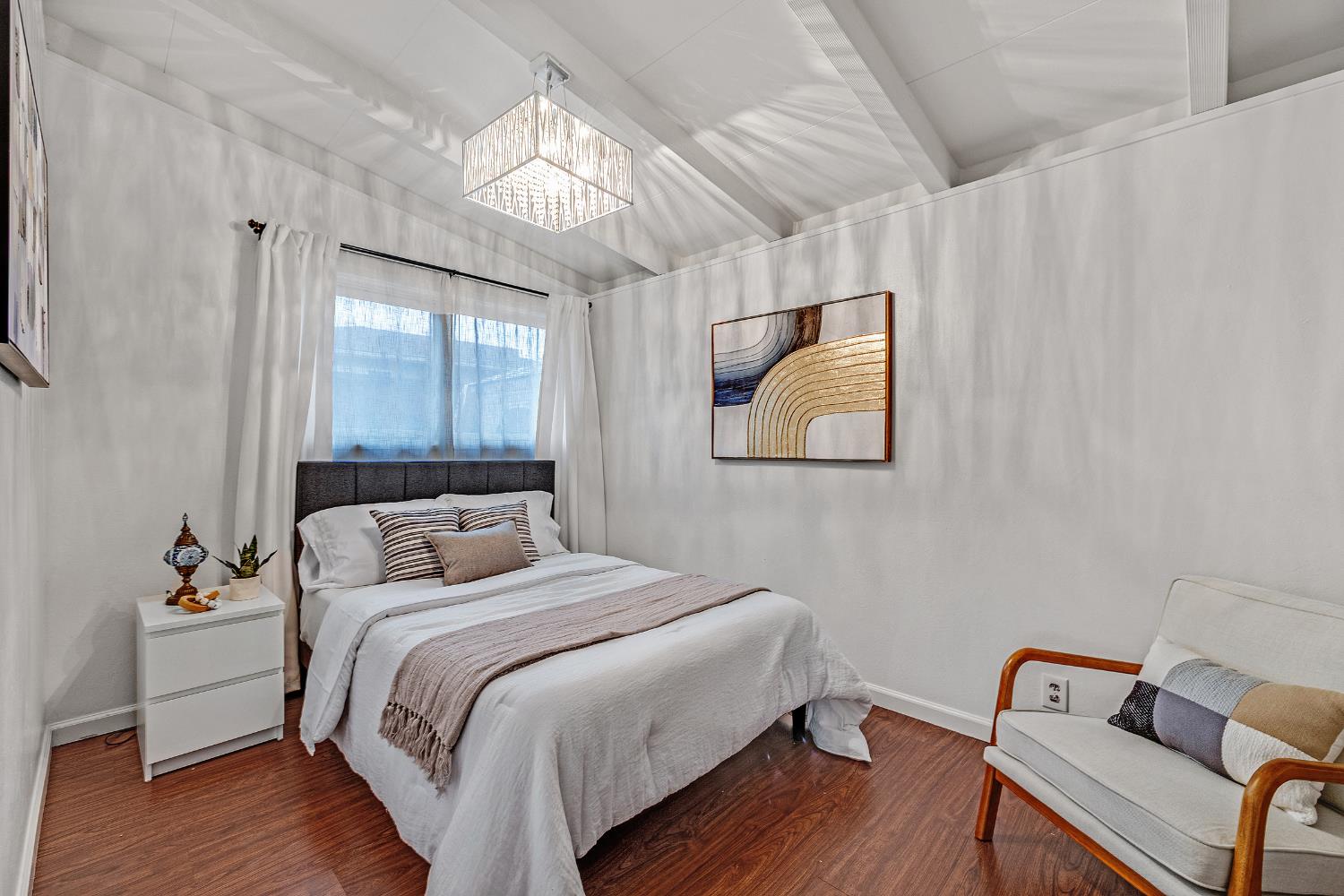 1481 Rieger Avenue Hayward, CA 94544 - Photo 21 of 34 a bedroom with a bed and wooden floor