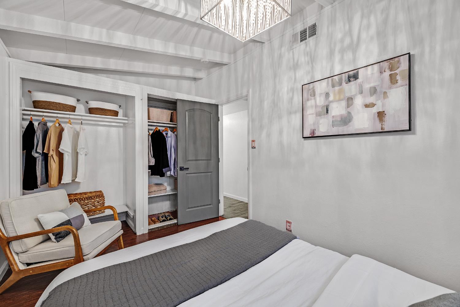 1481 Rieger Avenue Hayward, CA 94544 - Photo 22 of 34 a bedroom with a bed and a painting on the wall