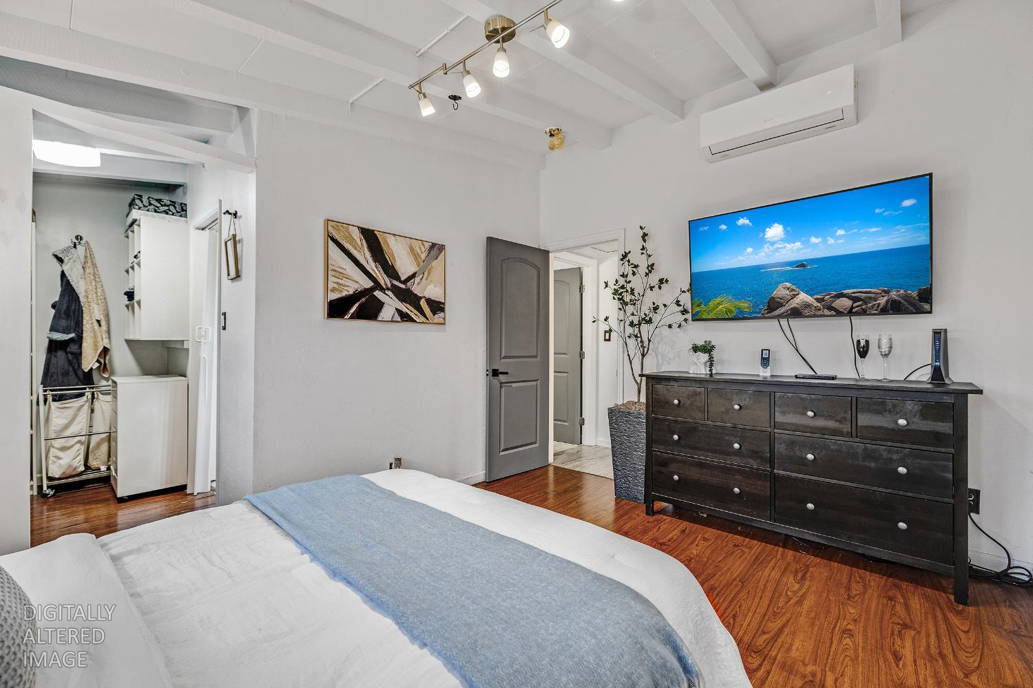 1481 Rieger Avenue Hayward, CA 94544 - Photo 25 of 34 a bedroom with a bed and a flat screen tv