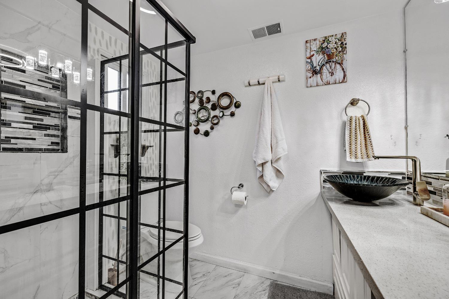 1481 Rieger Avenue Hayward, CA 94544 - Photo 27 of 34 a bathroom with a sink and mirror