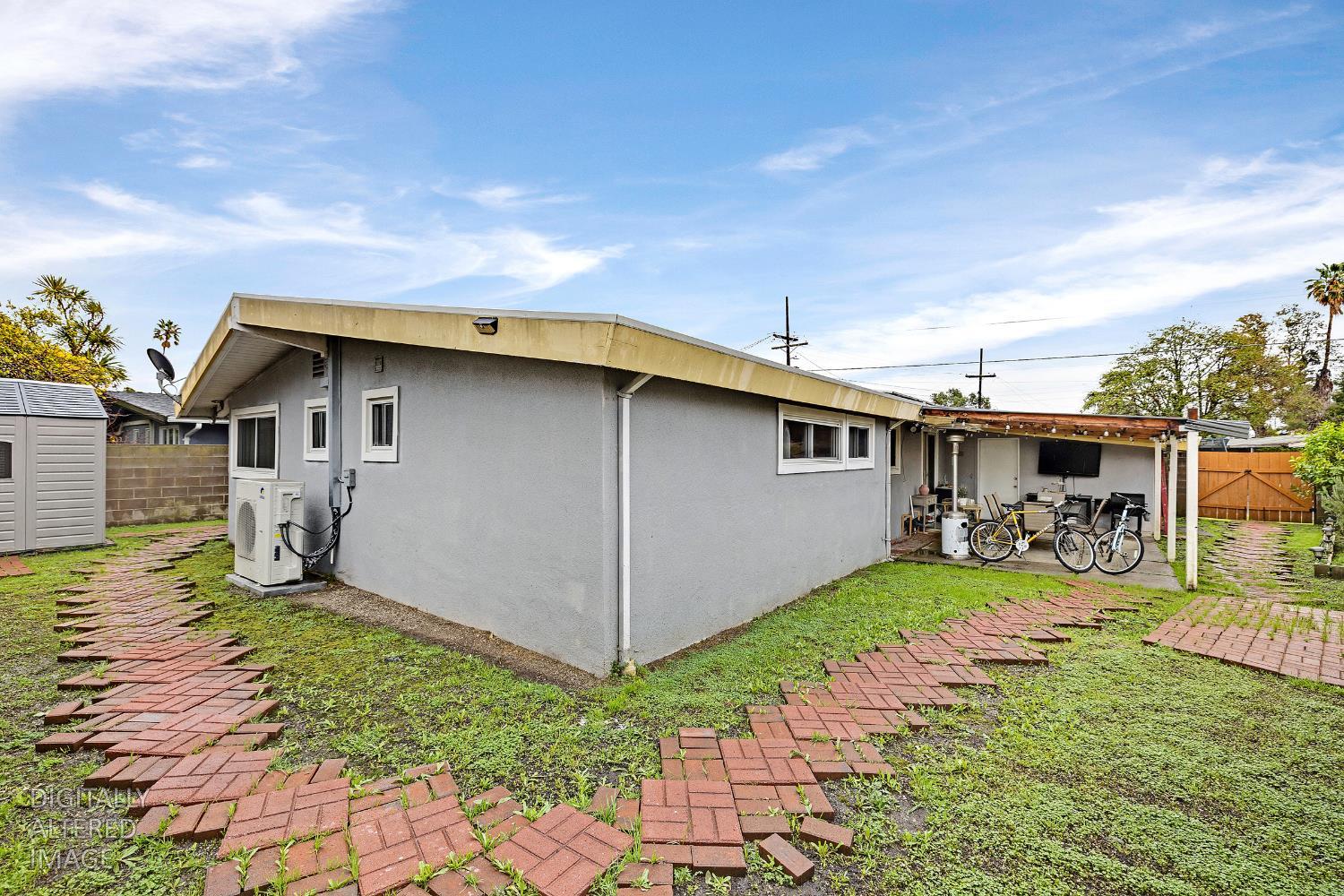 1481 Rieger Avenue Hayward, CA 94544 - Photo 7 of 34 a view of a white house with potted plants in front of it