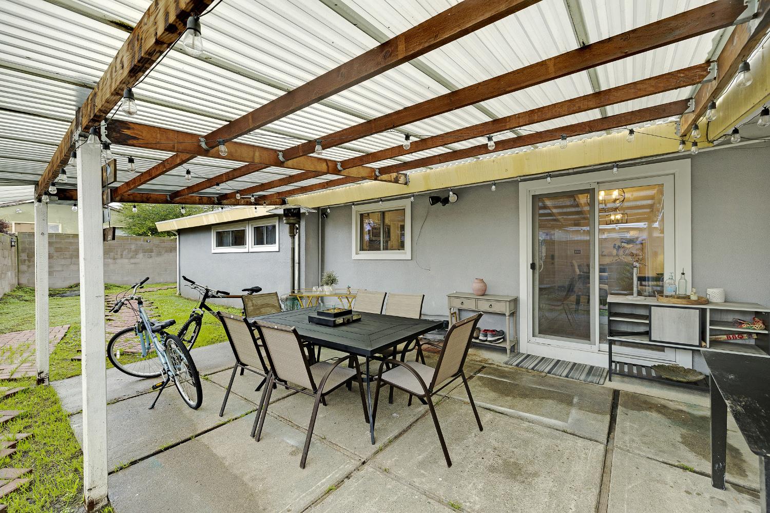 1481 Rieger Avenue Hayward, CA 94544 - Photo 9 of 34 a patio with table and chairs and potted plants