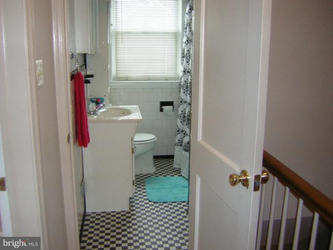 1677 Thetford Road Towson, MD 21286 - Photo 13 of 18 a bathroom with a toilet and a shower