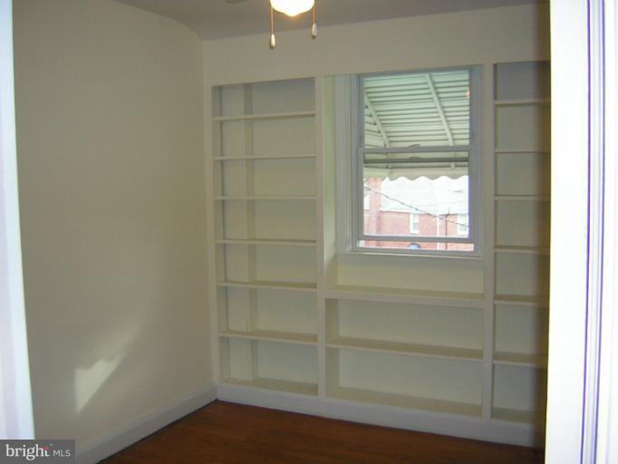 1677 Thetford Road Towson, MD 21286 - Photo 15 of 18 a view of empty room with wooden floor and fan