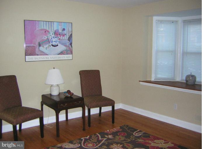 1677 Thetford Road Towson, MD 21286 - Photo 3 of 18 a view of a workspace with furniture and a potted plant