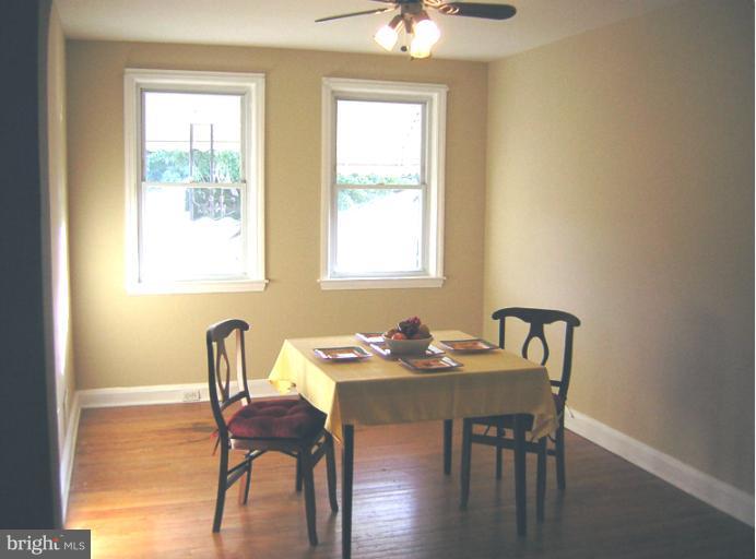 1677 Thetford Road Towson, MD 21286 - Photo 5 of 18 a view of a dining room with furniture and wooden floor
