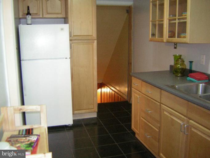 1677 Thetford Road Towson, MD 21286 - Photo 7 of 18 a kitchen with a refrigerator and a sink