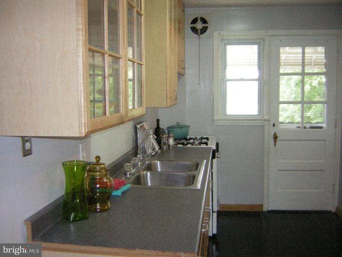 1677 Thetford Road Towson, MD 21286 - Photo 9 of 18 a room with wooden floor and windows