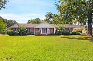 1053 Ashport Road Jackson, TN 38305 - Photo 1 of 42 a front view of a house with swimming pool