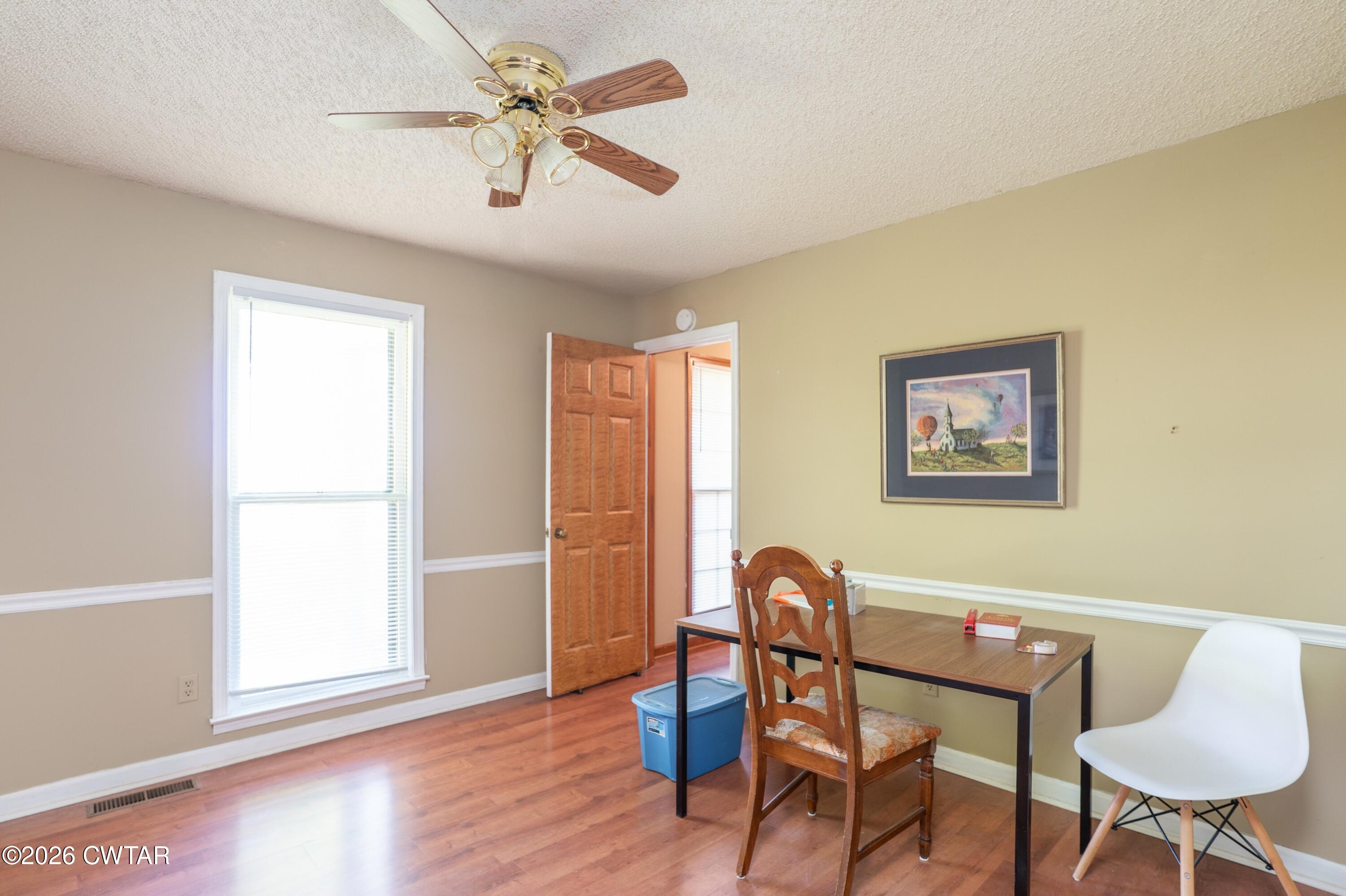 1053 Ashport Road Jackson, TN 38305 - Photo 13 of 42 a view of a workspace with furniture and a window