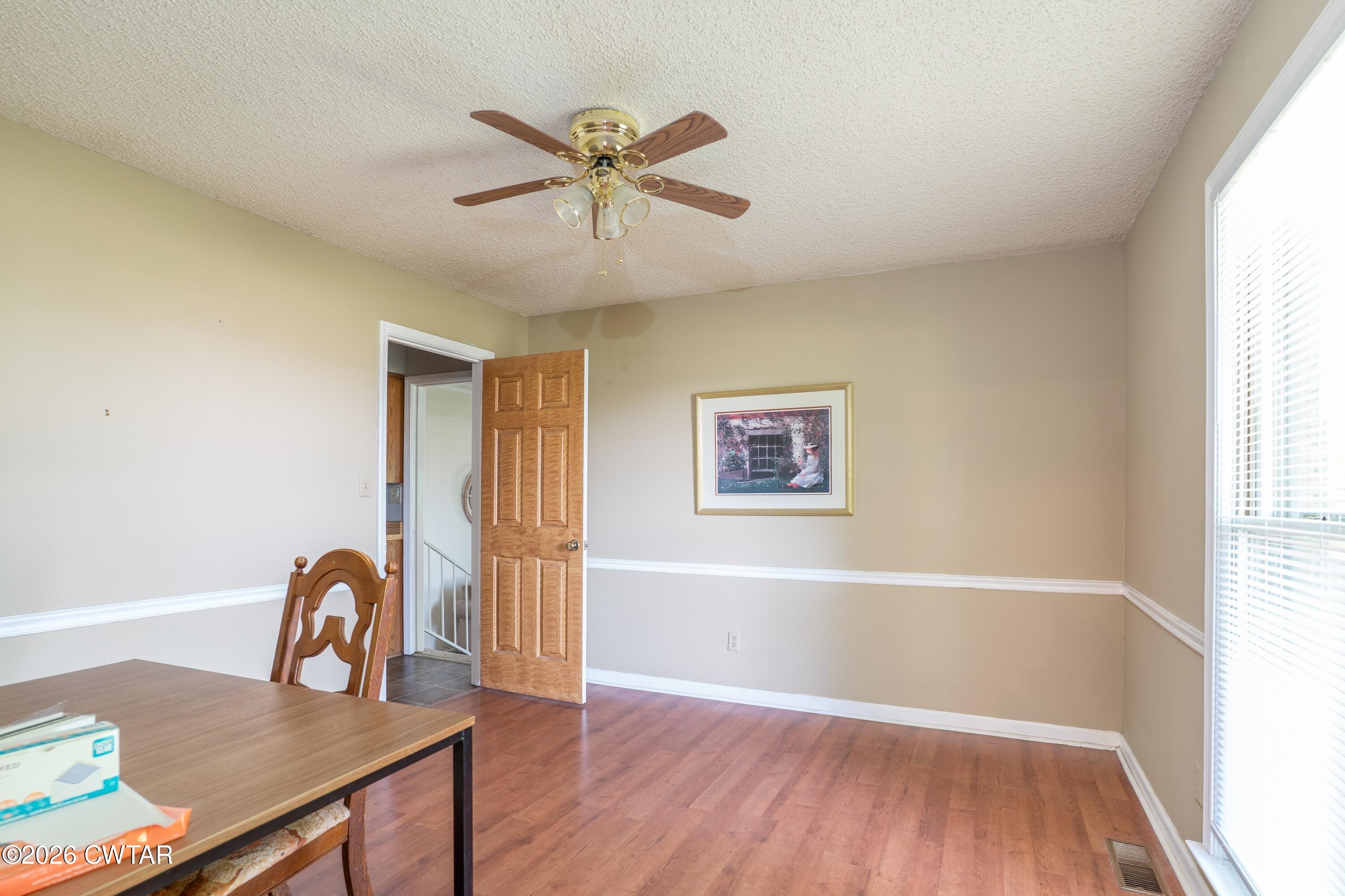 1053 Ashport Road Jackson, TN 38305 - Photo 15 of 42 a view of a workspace with furniture and window